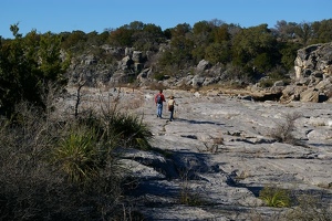 Hikers on dry river bed