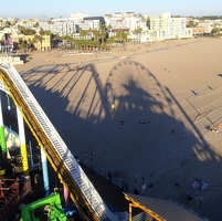 Ferris wheel shadow on beach